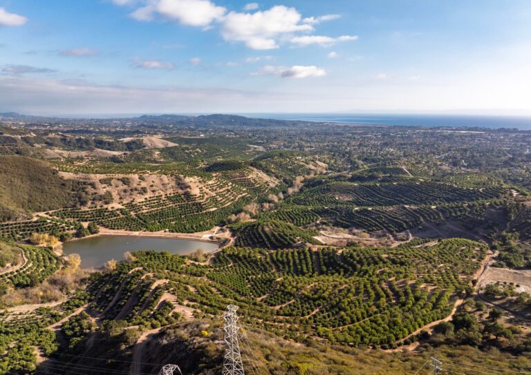 Wide aerial of the ranch, reservoir and coastline
