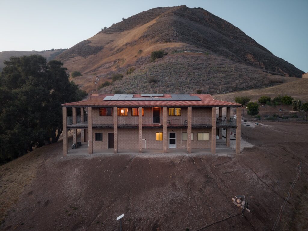 Lower level of the home at dusk with solar panels